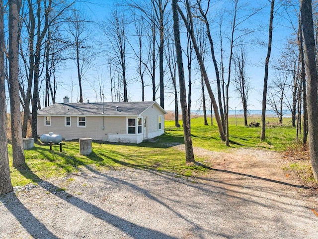229 Bay Rd, Peshtigo, WI 54147 - view of front facade with a front yard and a chimney