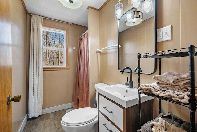 229 Bay Rd, Peshtigo, WI 54147 - bathroom featuring wood finished floors, toilet, baseboards, vanity, and a shower with shower curtain