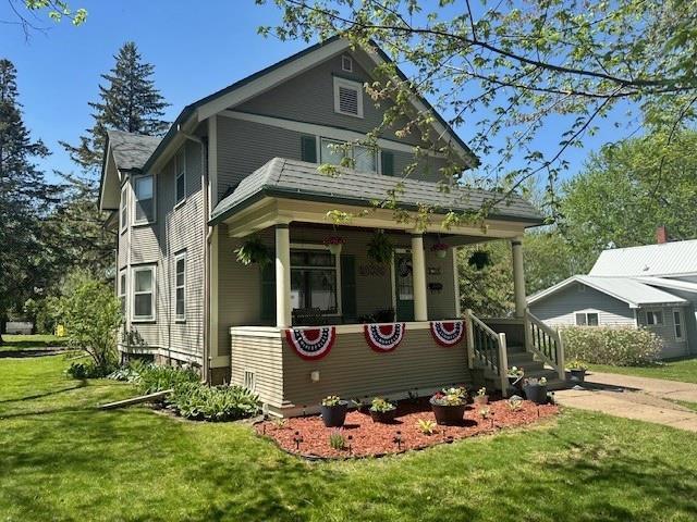 110 Hewett St, Neillsville, WI 54456 - view of front of property with a front lawn and a porch