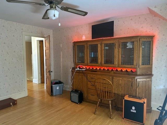 110 Hewett St, Neillsville, WI 54456 - interior space with wallpapered walls, light wood-style floors, and ceiling fan