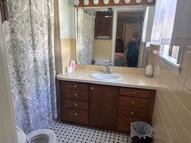 110 Hewett St, Neillsville, WI 54456 - full bathroom with ensuite bath, tile walls, vanity, and toilet