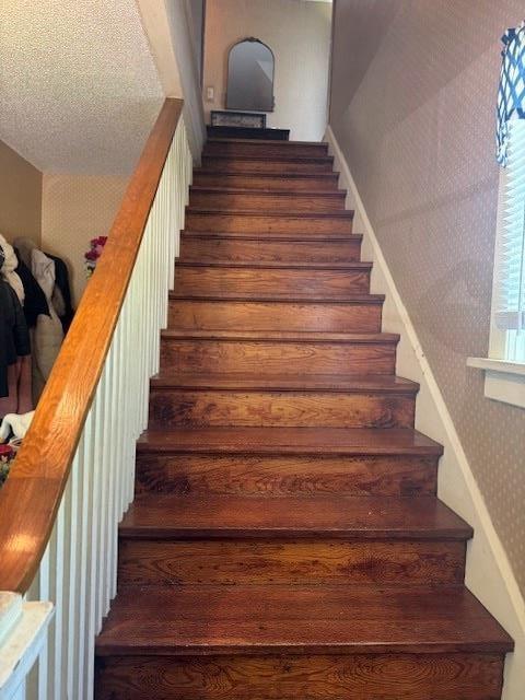 110 Hewett St, Neillsville, WI 54456 - stairway featuring wallpapered walls