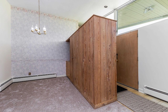 30 Elmer St, Platteville, WI 53818 - unfurnished dining area featuring a baseboard radiator, a chandelier, and carpet