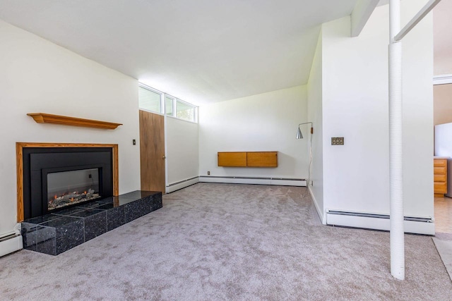30 Elmer St, Platteville, WI 53818 - unfurnished living room featuring carpet floors, a tile fireplace, a baseboard heating unit, and baseboards