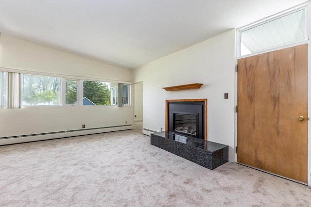 30 Elmer St, Platteville, WI 53818 - unfurnished living room with a baseboard radiator, vaulted ceiling, carpet floors, and a tiled fireplace