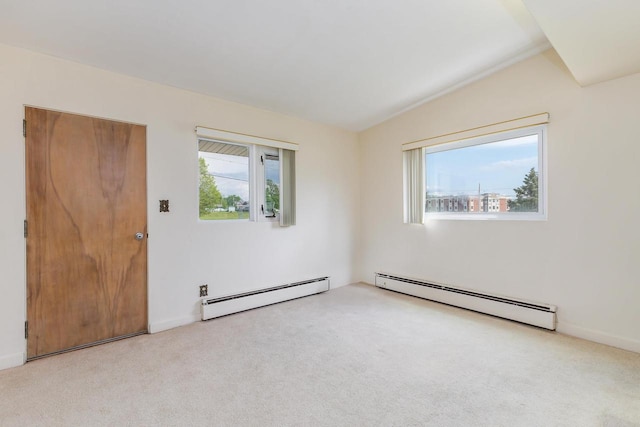 30 Elmer St, Platteville, WI 53818 - unfurnished room with baseboard heating, carpet flooring, and lofted ceiling