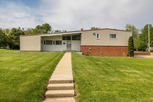 30 Elmer St, Platteville, WI 53818 - view of front of home with brick siding and a front lawn