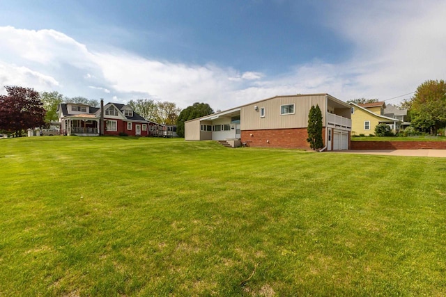 30 Elmer St, Platteville, WI 53818 - view of green lawn with an attached garage and driveway