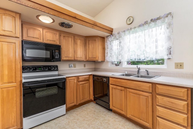 30 Elmer St, Platteville, WI 53818 - kitchen featuring black appliances, a sink, light countertops, and light floors