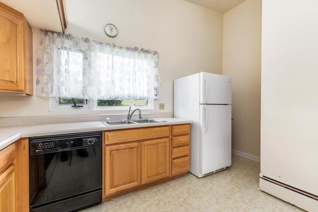 30 Elmer St, Platteville, WI 53818 - kitchen with black dishwasher, freestanding refrigerator, a baseboard radiator, a sink, and light countertops