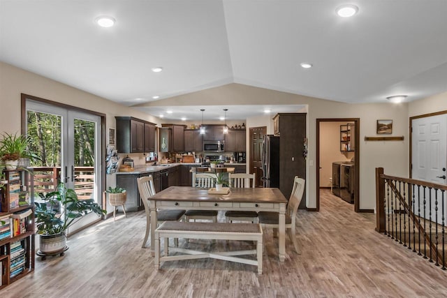 dining space with lofted ceiling, light wood finished floors, baseboards, and recessed lighting