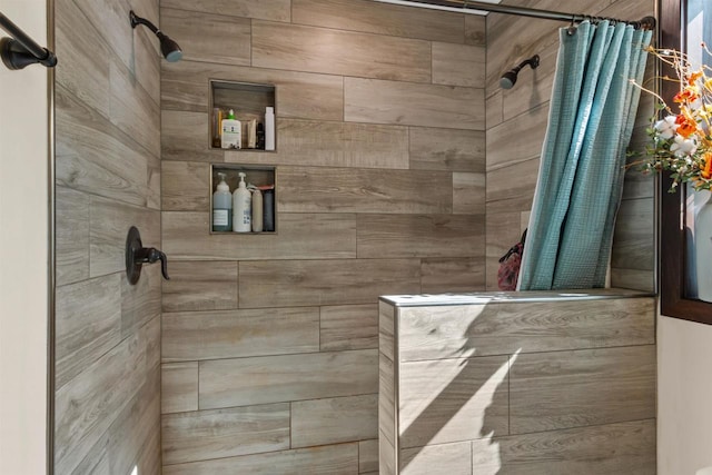full bathroom with a tile shower