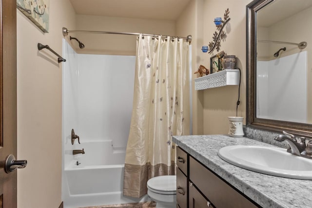 bathroom featuring toilet, shower / bath combination with curtain, and vanity