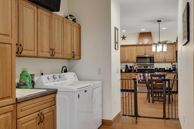 2149 Abbey Rd Unit 2147-2145, Onalaska, WI 54650 - washroom with washing machine and dryer, light wood-style flooring, and recessed lighting