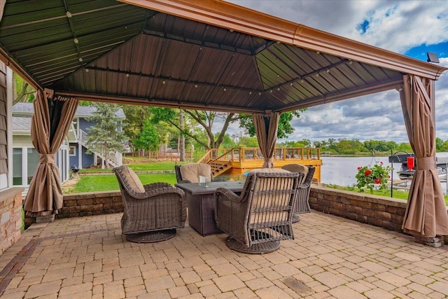 W11601 Demynck Rd, Lodi, WI 53555 - view of patio featuring a gazebo, a water view, and outdoor dining space