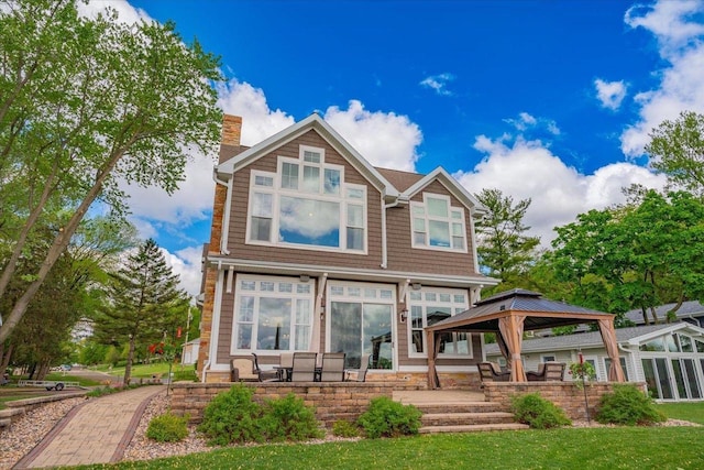 W11601 Demynck Rd, Lodi, WI 53555 - back of house with a chimney and a gazebo