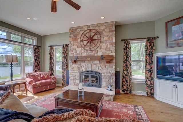 W11601 Demynck Rd, Lodi, WI 53555 - living area featuring ceiling fan, light wood-style flooring, baseboards, a stone fireplace, and recessed lighting
