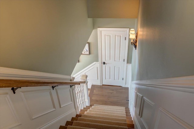 W11601 Demynck Rd, Lodi, WI 53555 - stairway with a decorative wall, wood finished floors, and a wainscoted wall