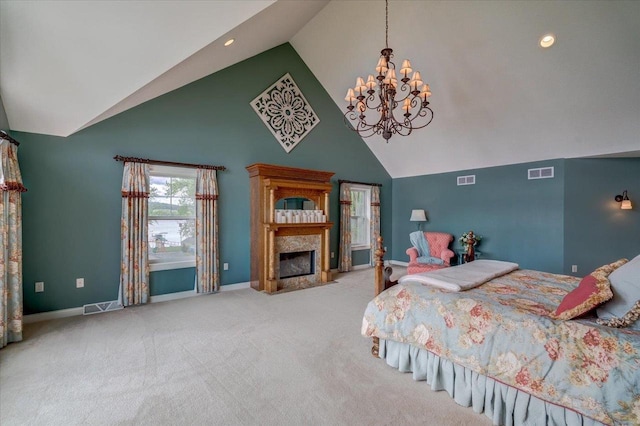 W11601 Demynck Rd, Lodi, WI 53555 - carpeted bedroom with a chandelier, high vaulted ceiling, baseboards, recessed lighting, and a fireplace with flush hearth