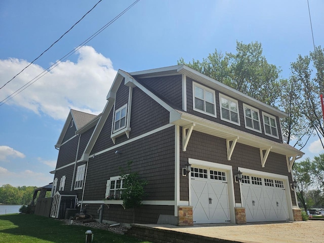 W11601 Demynck Rd, Lodi, WI 53555 - view of side of property featuring a garage and dirt driveway