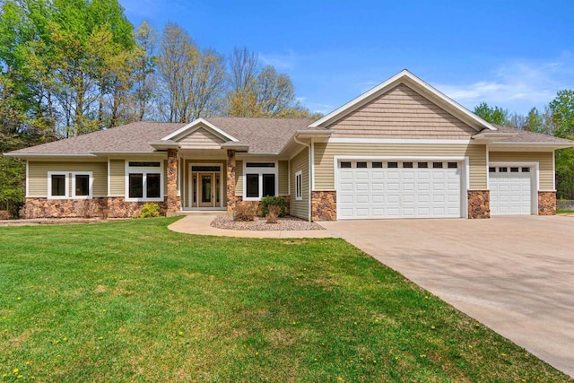 6056 Sharonwood Ln, Stevens Point, WI 54482 - view of front facade with stone siding, a garage, driveway, and a front lawn