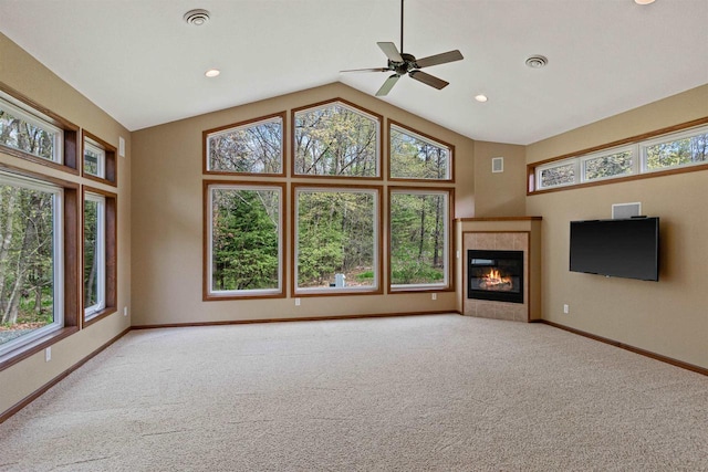 6056 Sharonwood Ln, Stevens Point, WI 54482 - unfurnished living room featuring high vaulted ceiling, carpet, baseboards, a ceiling fan, and a tiled fireplace