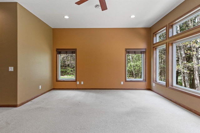 6056 Sharonwood Ln, Stevens Point, WI 54482 - unfurnished room featuring light colored carpet, baseboards, ceiling fan, and recessed lighting
