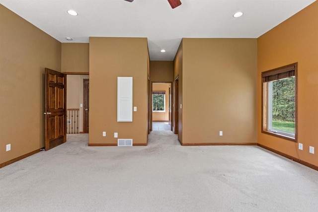 6056 Sharonwood Ln, Stevens Point, WI 54482 - spare room with a ceiling fan, light carpet, baseboards, and recessed lighting