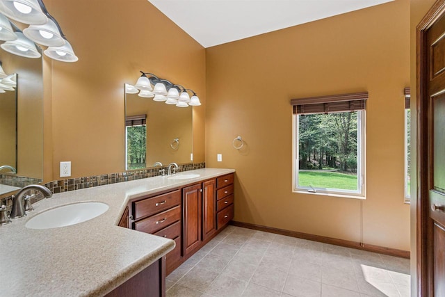 6056 Sharonwood Ln, Stevens Point, WI 54482 - bathroom featuring plenty of natural light, double vanity, baseboards, and tile patterned flooring