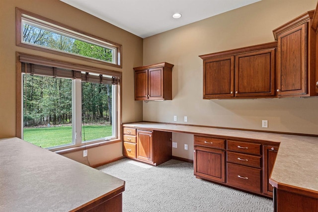 6056 Sharonwood Ln, Stevens Point, WI 54482 - unfurnished office featuring built in study area, light carpet, and baseboards