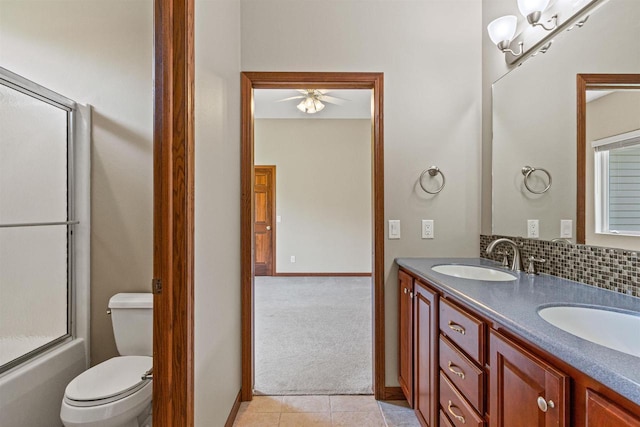 6056 Sharonwood Ln, Stevens Point, WI 54482 - bathroom featuring a ceiling fan, tile patterned flooring, double vanity, toilet, and baseboards
