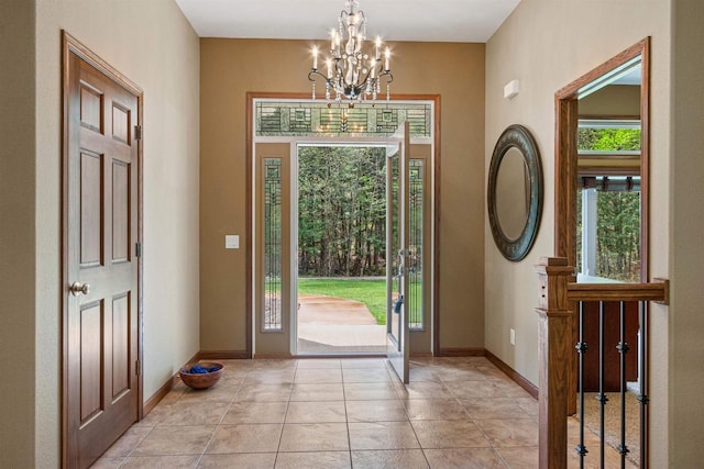 6056 Sharonwood Ln, Stevens Point, WI 54482 - entrance foyer with healthy amount of natural light, a chandelier, and baseboards