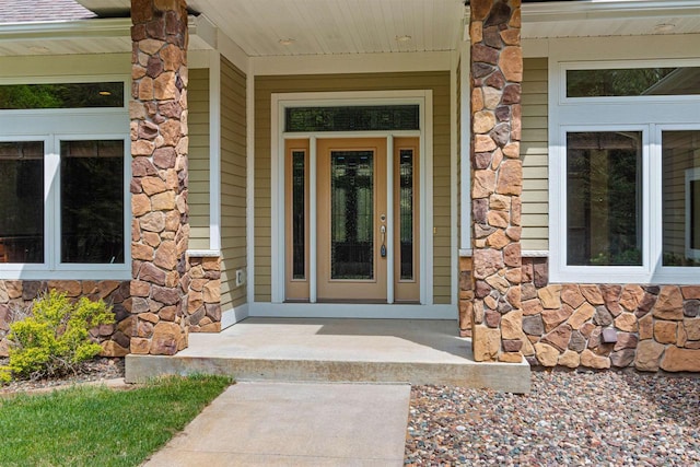 6056 Sharonwood Ln, Stevens Point, WI 54482 - property entrance with stone siding and covered porch
