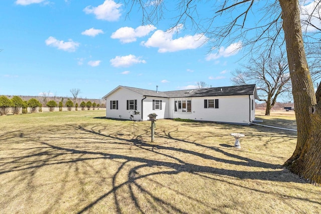N8608 Strat Rd, Iola, WI 54945 - rear view of property featuring a lawn