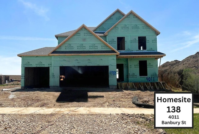 4011 Banbury St, Windsor, WI 53598 - property in mid-construction featuring covered porch, a mountain view, and a garage