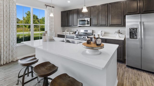 4011 Banbury St, Windsor, WI 53598 - kitchen with appliances with stainless steel finishes, a sink, light wood finished floors, healthy amount of natural light, and recessed lighting