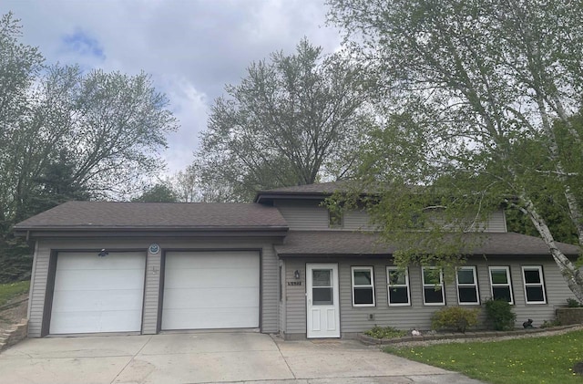 N422 Dons Dr, Appleton, WI 54915 - view of front of home featuring concrete driveway, an attached garage, and roof with shingles