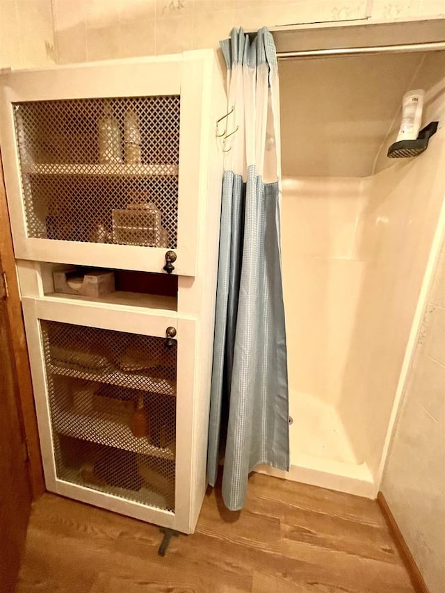N422 Dons Dr, Appleton, WI 54915 - full bathroom with curtained shower and wood finished floors