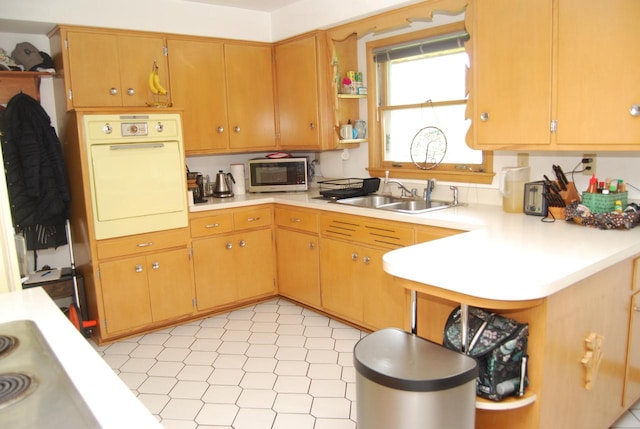 3207 County Rd W, Port Washington, WI 53074 - kitchen with stainless steel microwave, a sink, oven, light countertops, and open shelves