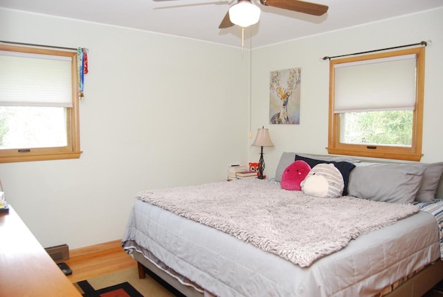 3207 County Rd W, Port Washington, WI 53074 - bedroom with wood finished floors and a ceiling fan
