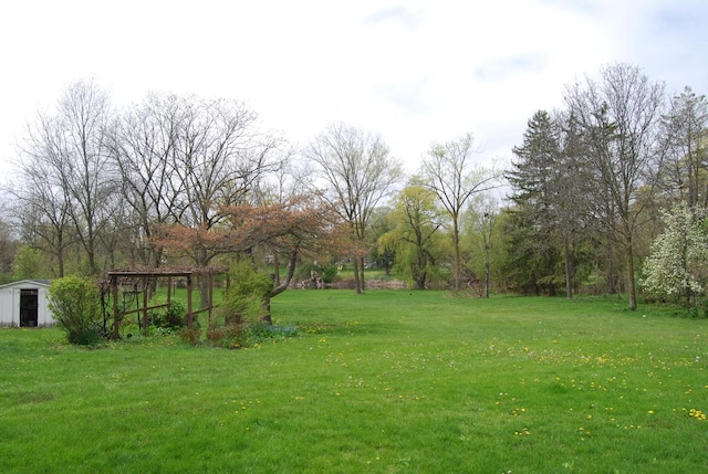 3207 County Rd W, Port Washington, WI 53074 - view of grassy yard with an outdoor structure