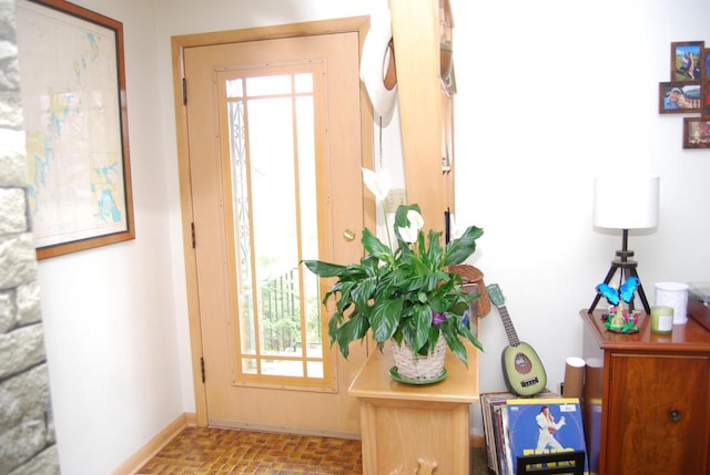 3207 County Rd W, Port Washington, WI 53074 - entryway with brick flooring, plenty of natural light, and baseboards