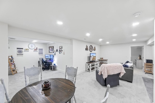 dining room with light carpet, recessed lighting, and baseboards