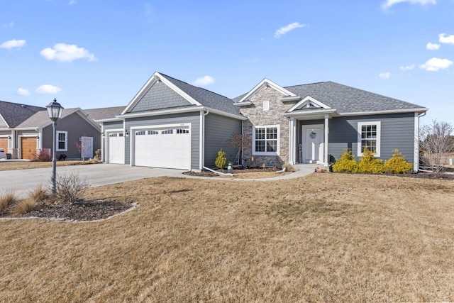 single story home featuring an attached garage, driveway, a front yard, stone siding, and roof with shingles