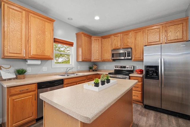 416 Rimrock Rd, Janesville, WI 53548 - kitchen featuring stainless steel appliances, a sink, dark wood-style floors, recessed lighting, and light countertops