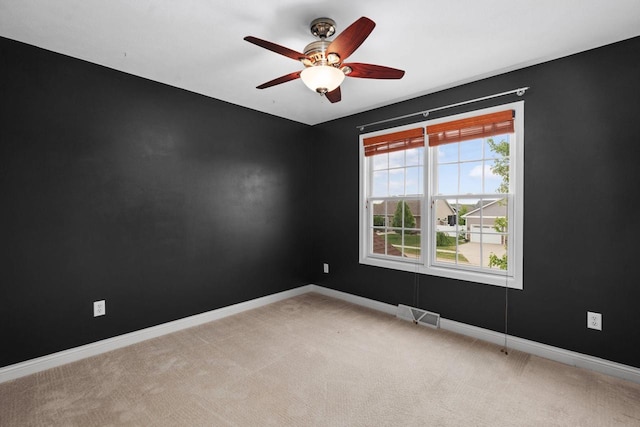 416 Rimrock Rd, Janesville, WI 53548 - spare room featuring ceiling fan, light carpet, and baseboards