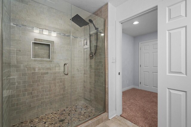 416 Rimrock Rd, Janesville, WI 53548 - bathroom featuring a shower stall, baseboards, and recessed lighting