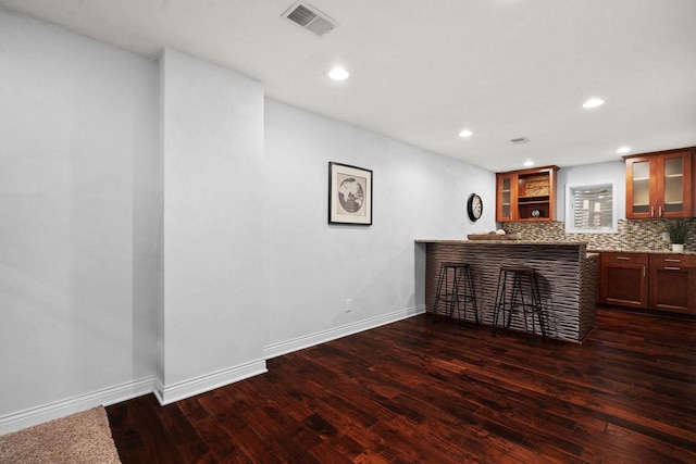 416 Rimrock Rd, Janesville, WI 53548 - indoor dry bar with dark wood-style flooring, decorative backsplash, recessed lighting, and baseboards