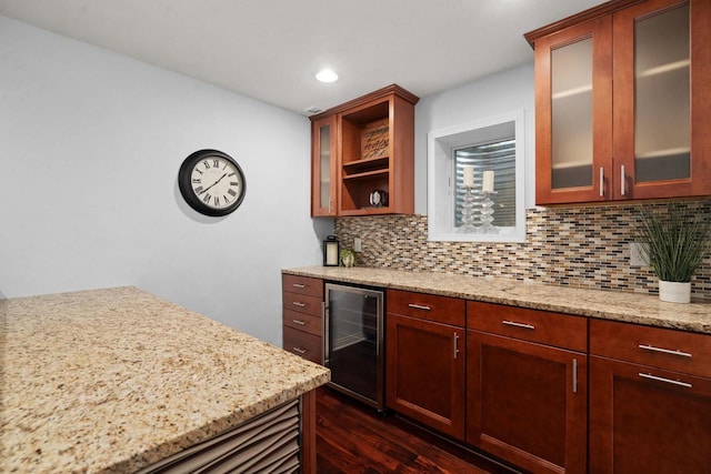 416 Rimrock Rd, Janesville, WI 53548 - kitchen with beverage cooler, dark wood-style flooring, decorative backsplash, light stone counters, and recessed lighting