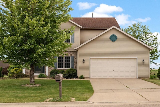 416 Rimrock Rd, Janesville, WI 53548 - view of front of house with concrete driveway, a front yard, an attached garage, and a shingled roof